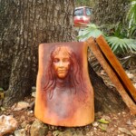 Woman sculpted in wood. Notice the 2 tone wood - beautiful!